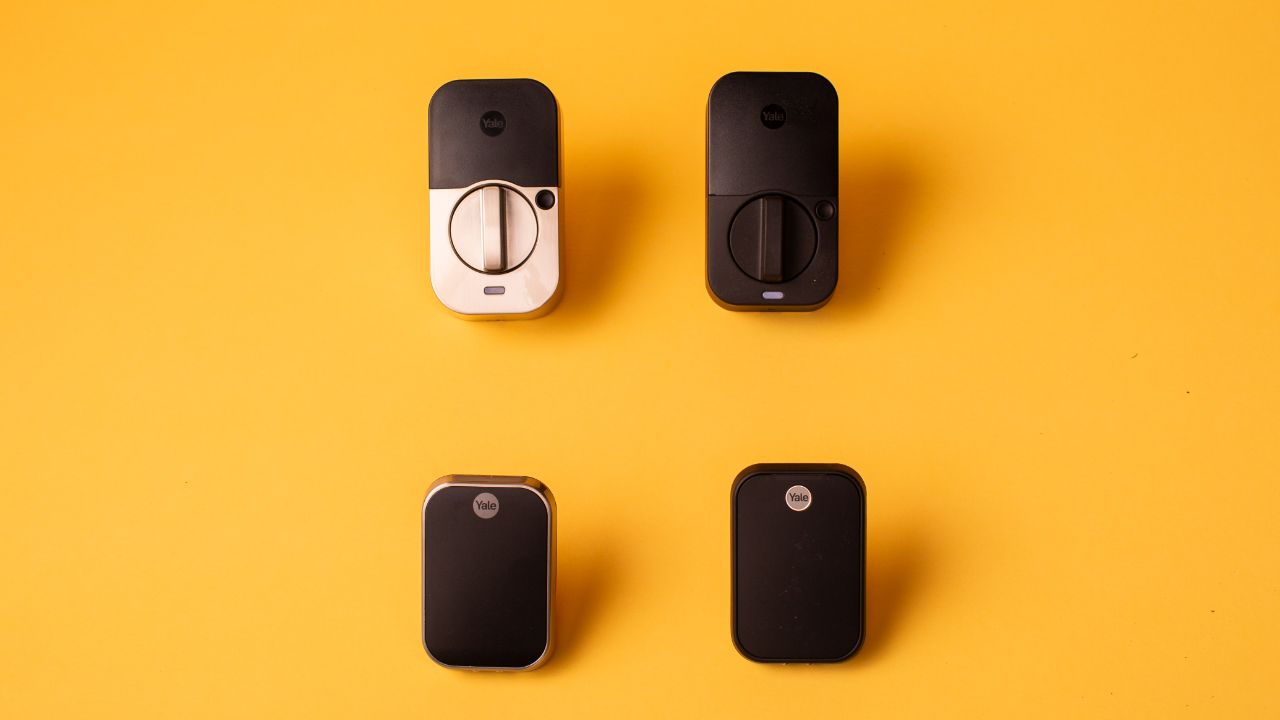 Several Yale Assure Lock 2 Touch models on a yellow background.