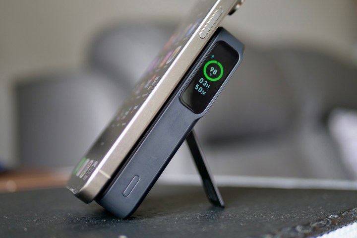 The iPhone 15 Pro Max being charged by the Anker MagGo Power Bank.