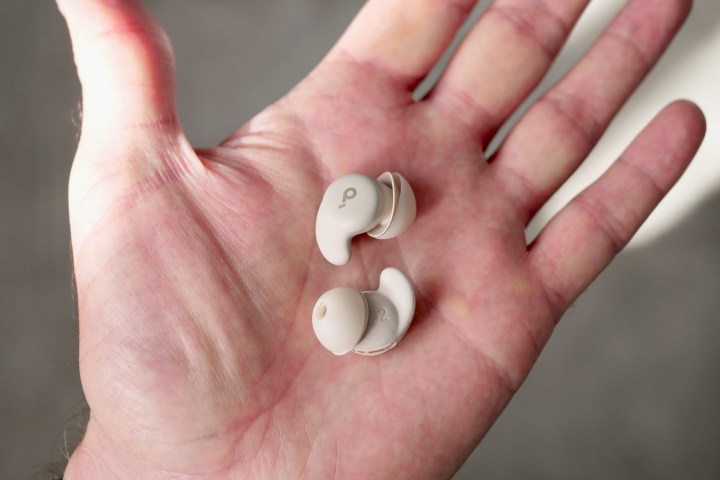 A person holding the Anker Soundcore Sleep A20's earbuds.