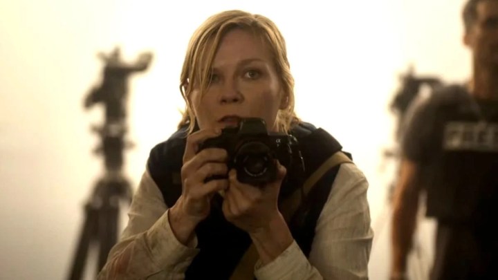 Kirsten Dunst aims her camera in Civil War