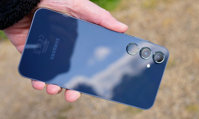 A person holding the Samsung Galaxy A55.