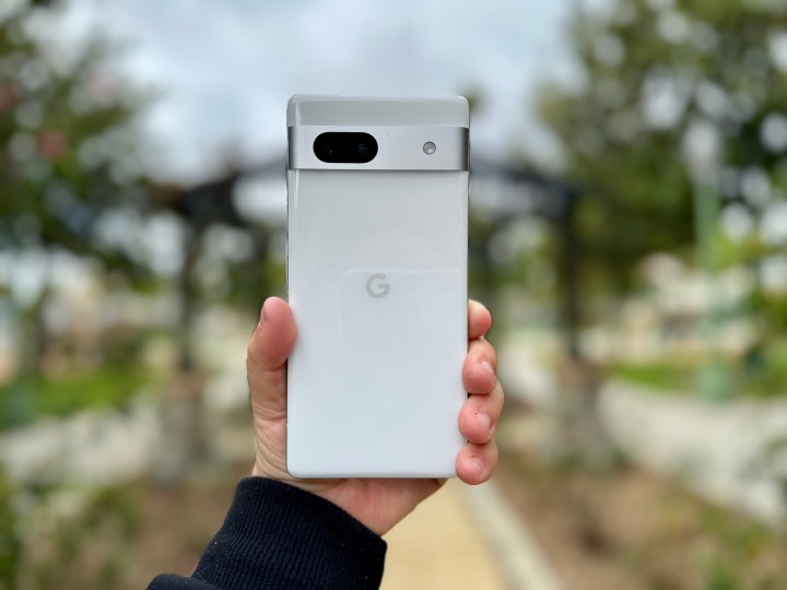 Google Pixel 7a in Snow in hand portrait.