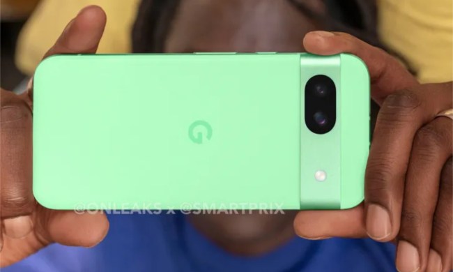 A photo of someone holding the mint Google Pixel 8a.