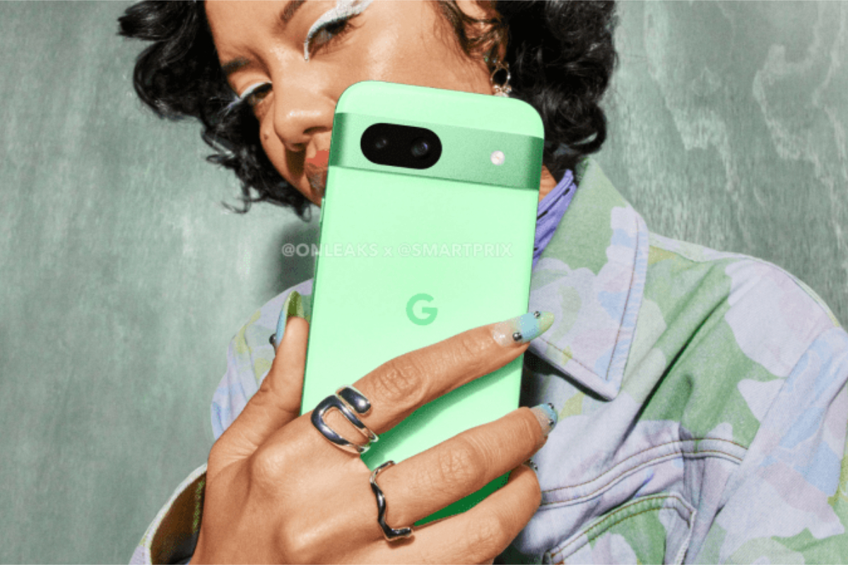 A photo of someone holding the mint Google Pixel 8a.