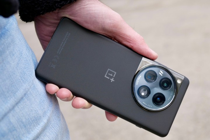A person holding the OnePlus 12.