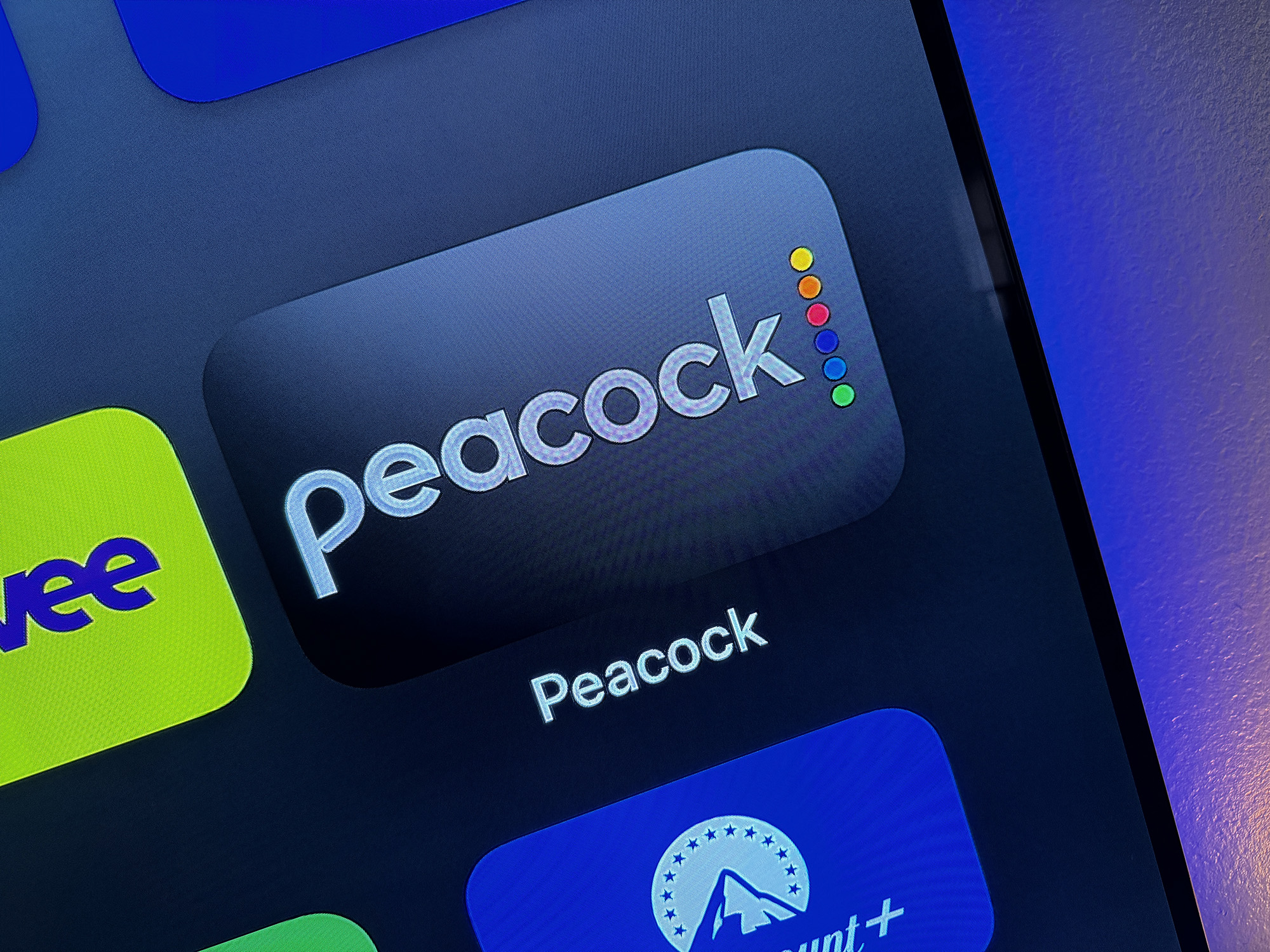 The Peacock app icon on Apple TV.