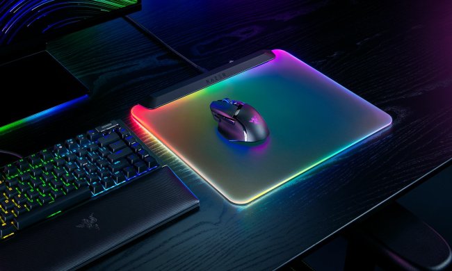 The Razer Firefly V2 Pro mouse pad sitting on a desk.