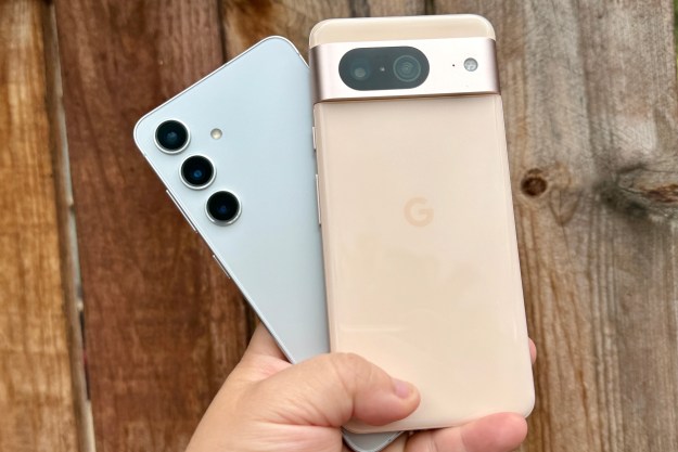 Samsung Galaxy S24 (left) and Google Pixel 8 in hand.