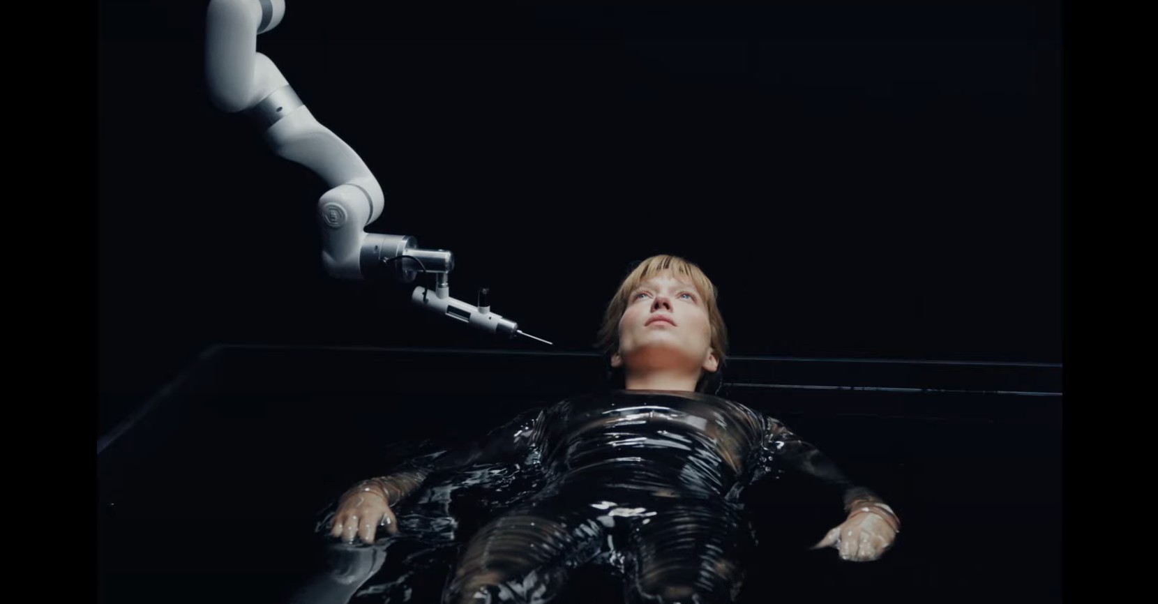 A woman is probed by a machine in The Beast.