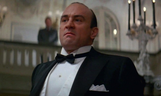 Robert De Niro standing tall in a tuxedo looking menacing in a scene from The Untouchables.