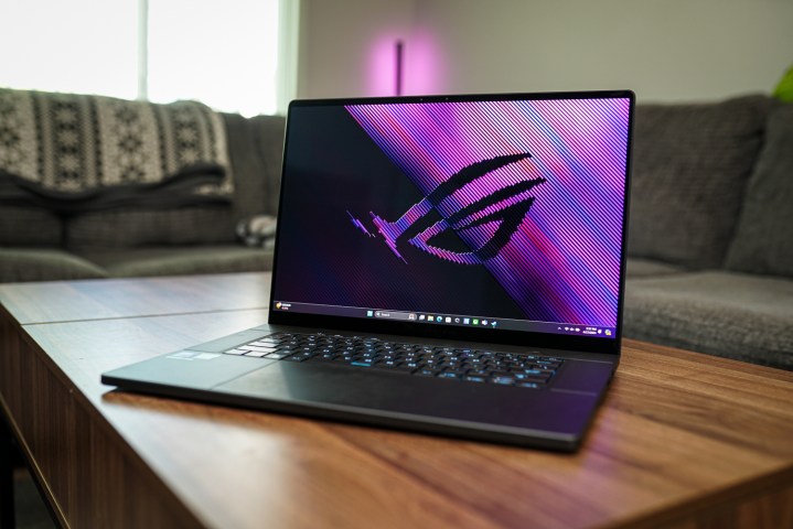 The Asus ROG Zephyrus G16 sitting on a coffee table.