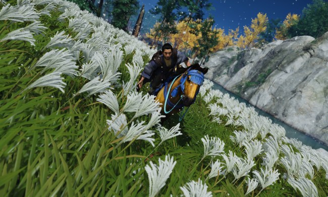 Jin riding through a field of flowers.