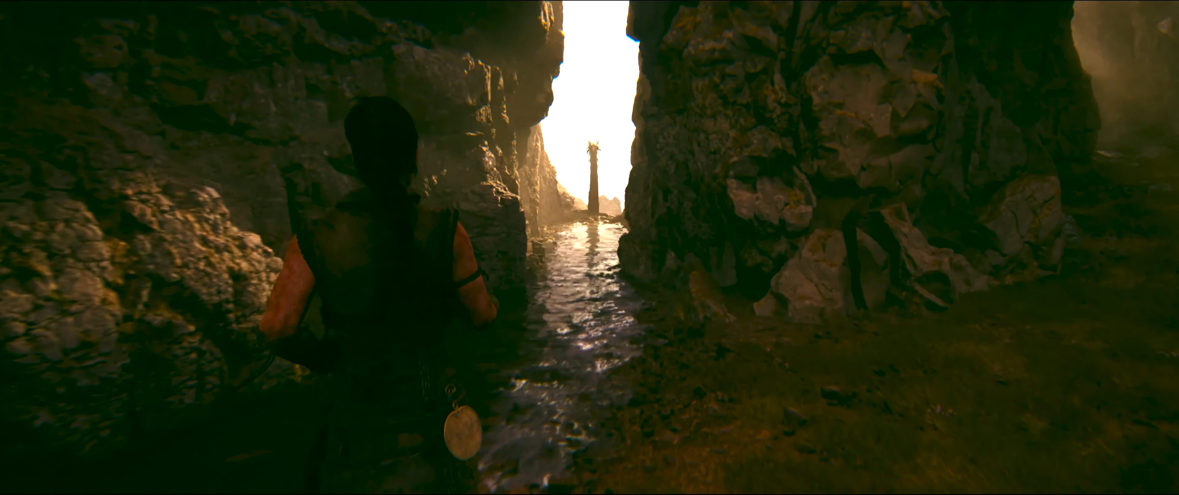 Senua approaching a lore totem in Hellblade 2.
