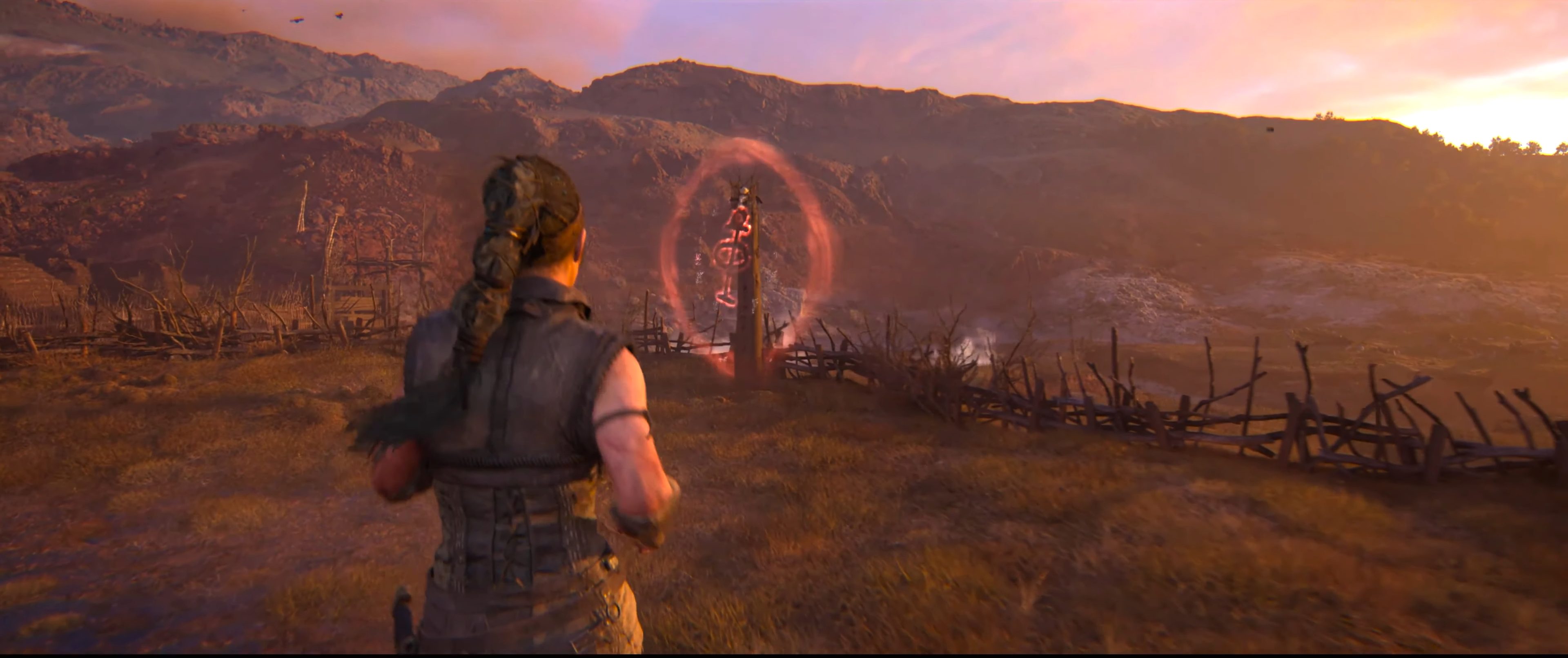 Senua approaching a lore totem in Hellblade 2.