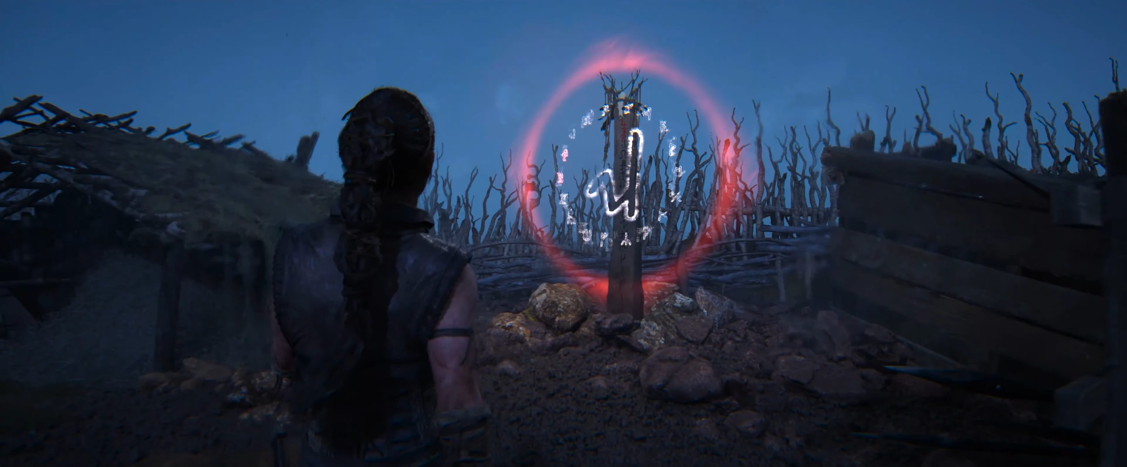 Senua approaching a lore totem in Hellblade 2.