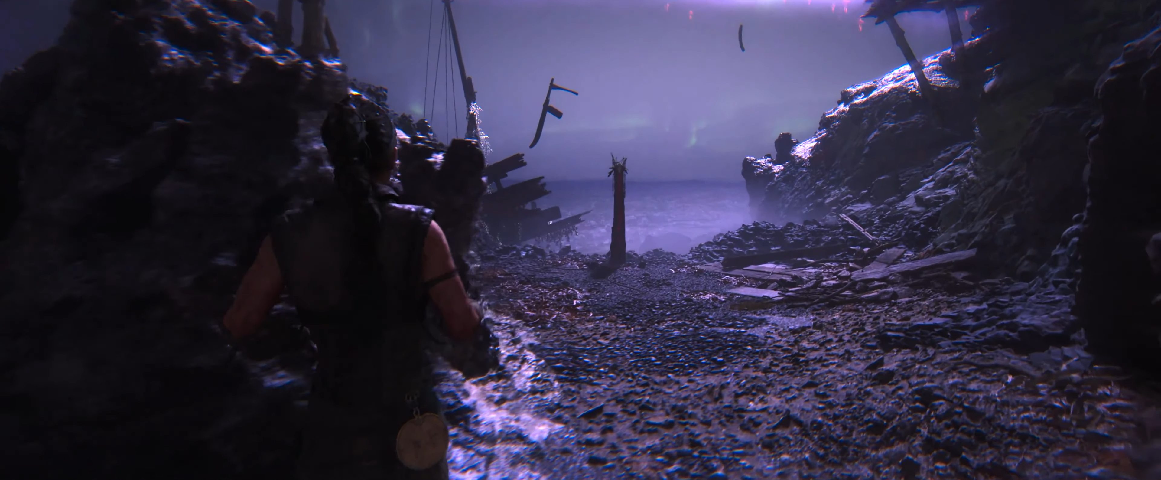 Senua approaching a lore totem in Hellblade 2.