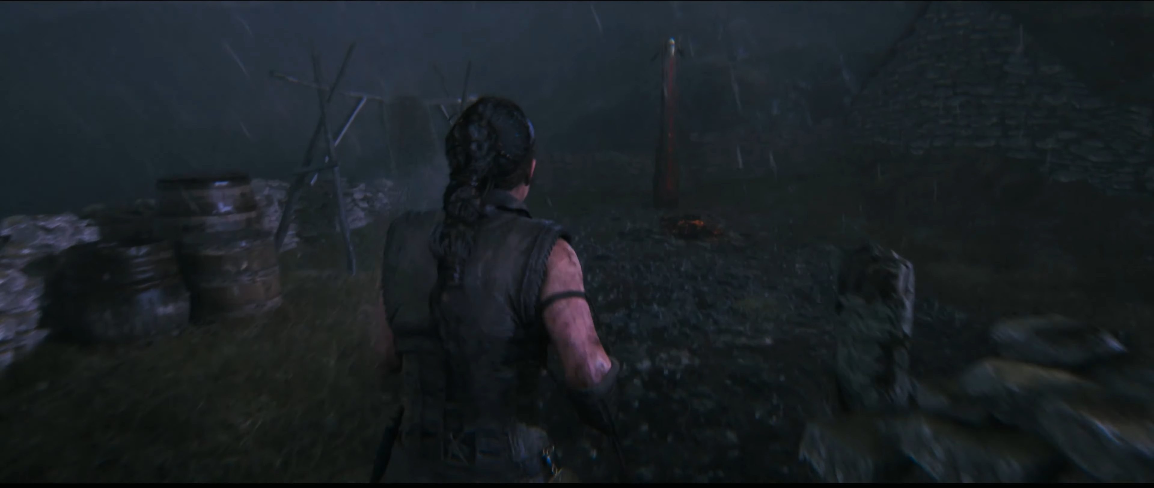 Senua approaching a lore totem in Hellblade 2.