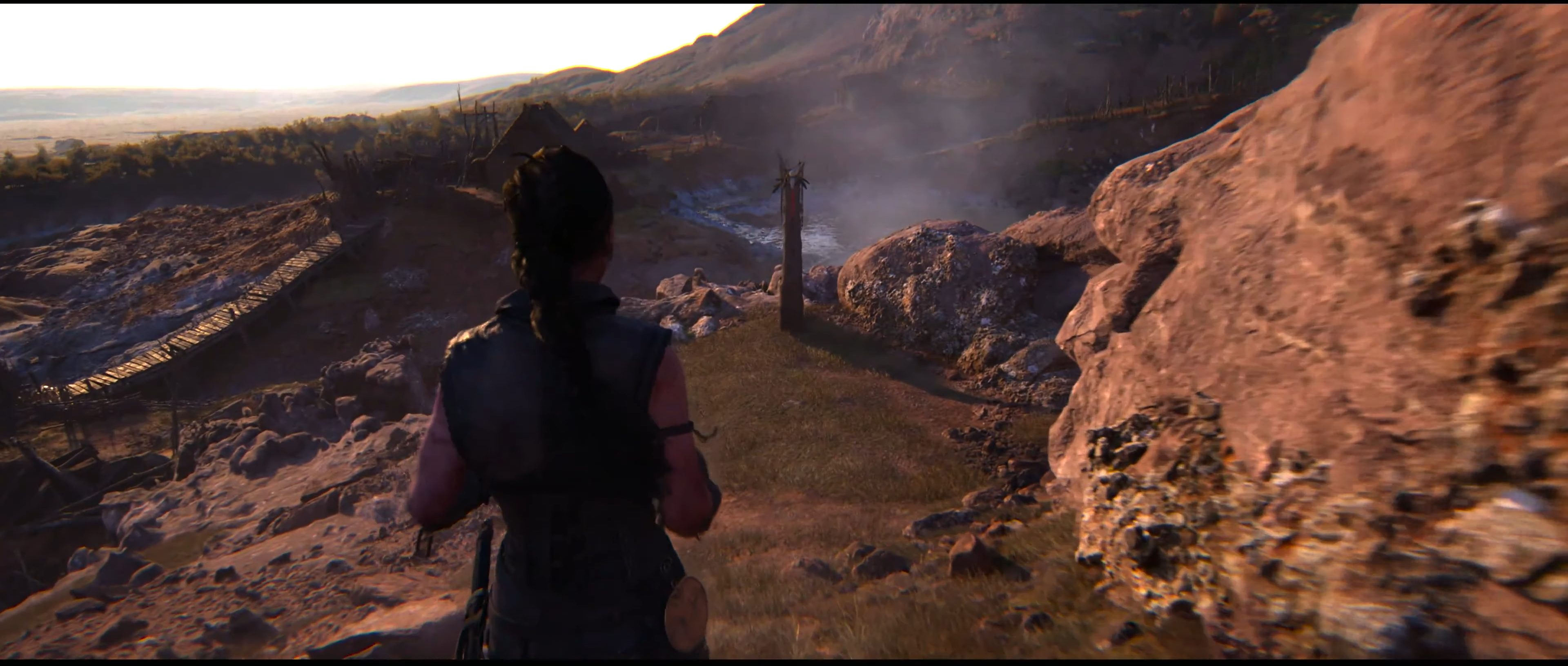 Senua approaching a lore totem in Hellblade 2.