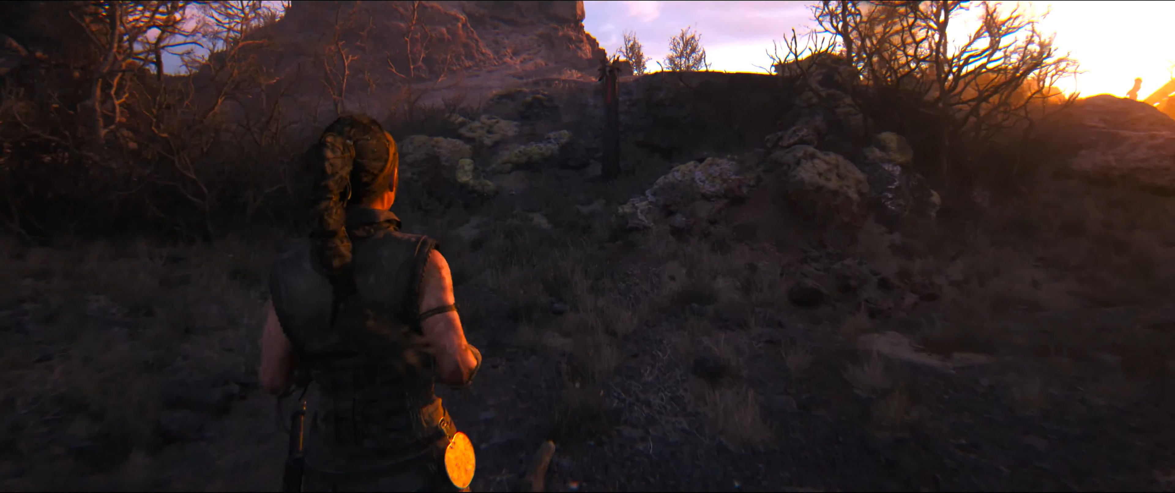 Senua approaching a lore totem in Hellblade 2.