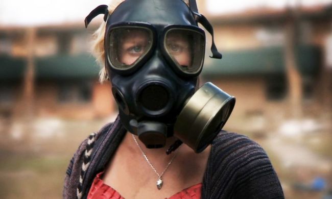 A woman wears a gasmask in the movie Monsters