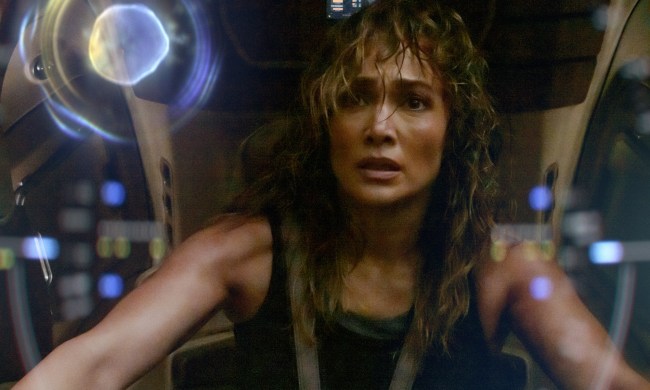 Jennifer Lopez sits in an AI robot suit and stares at the screen.