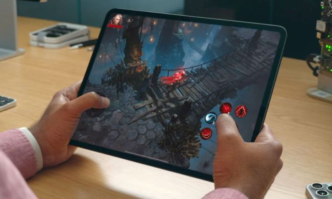A person gaming on the M4 iPad Pro and playing Diablo Immortal.