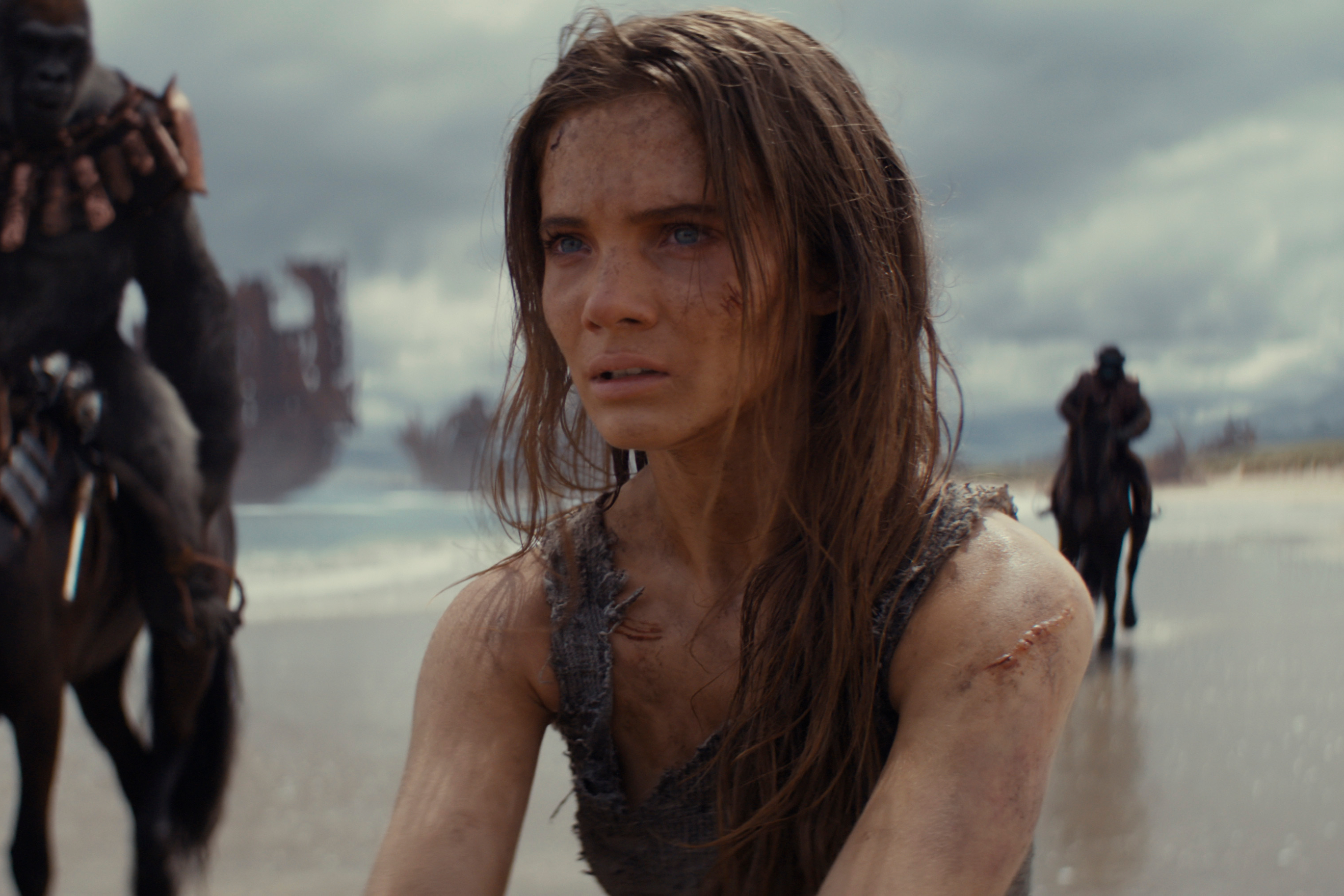Mae stands on a beach in Kingdom of the Planet of the Apes.