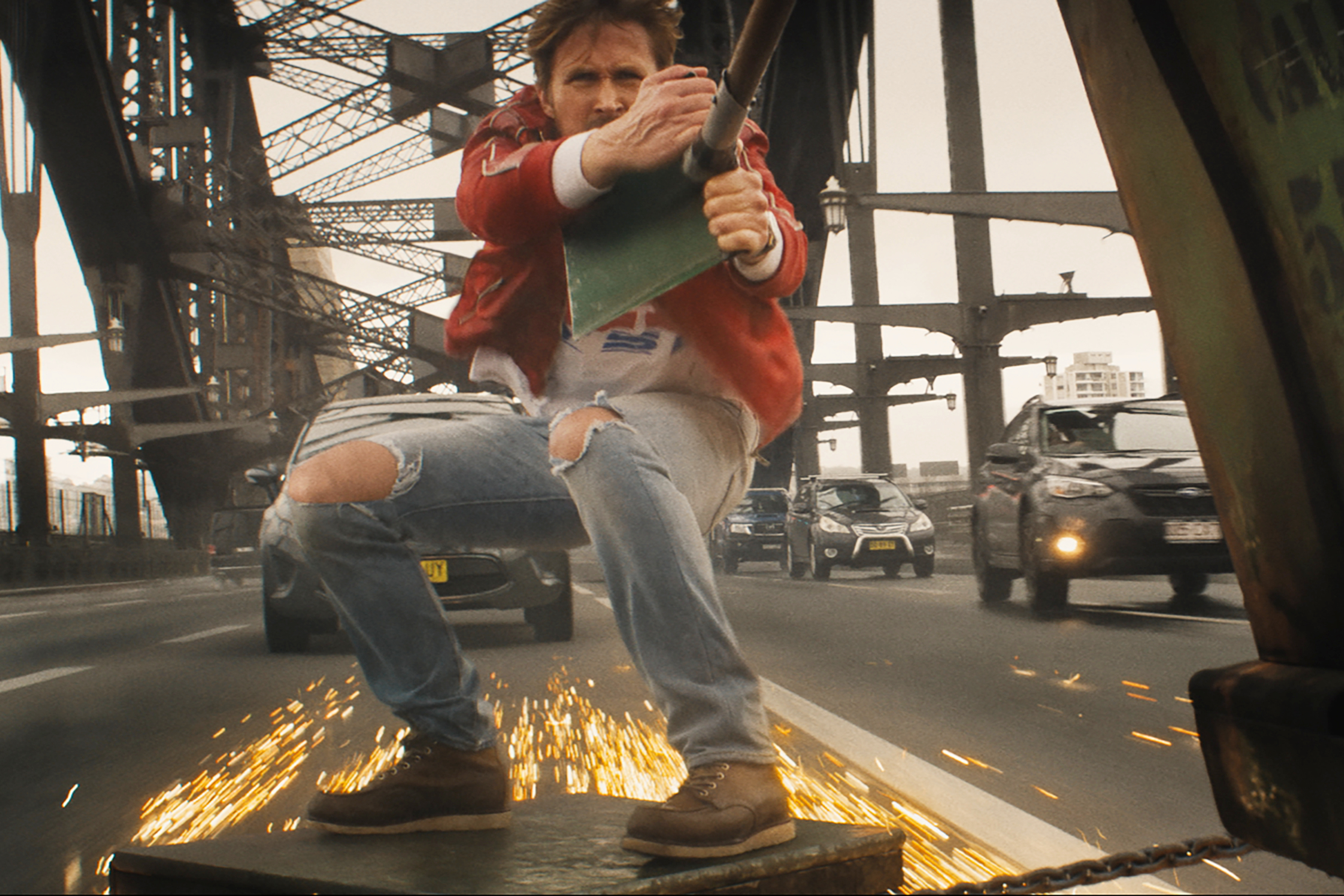 Ryan Gosling rides a broken piece of metal in The Fall Guy.