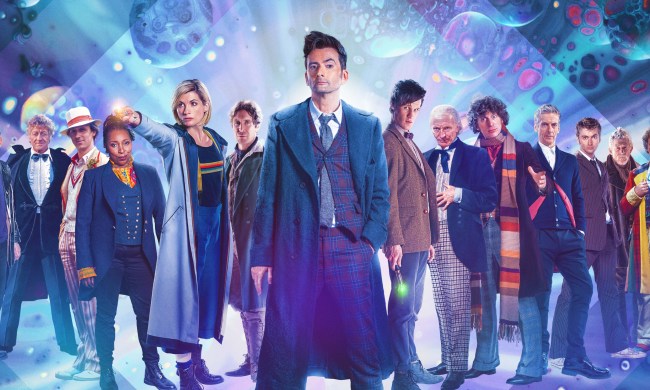 The Doctors all stand in a line on a Doctor Who promotional poster.