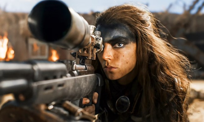 Furiosa aims her rifle in Furiosa: A Mad Max Saga.