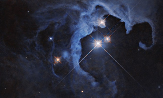 This NASA Hubble Space Telescope image captures a triple-star star system.