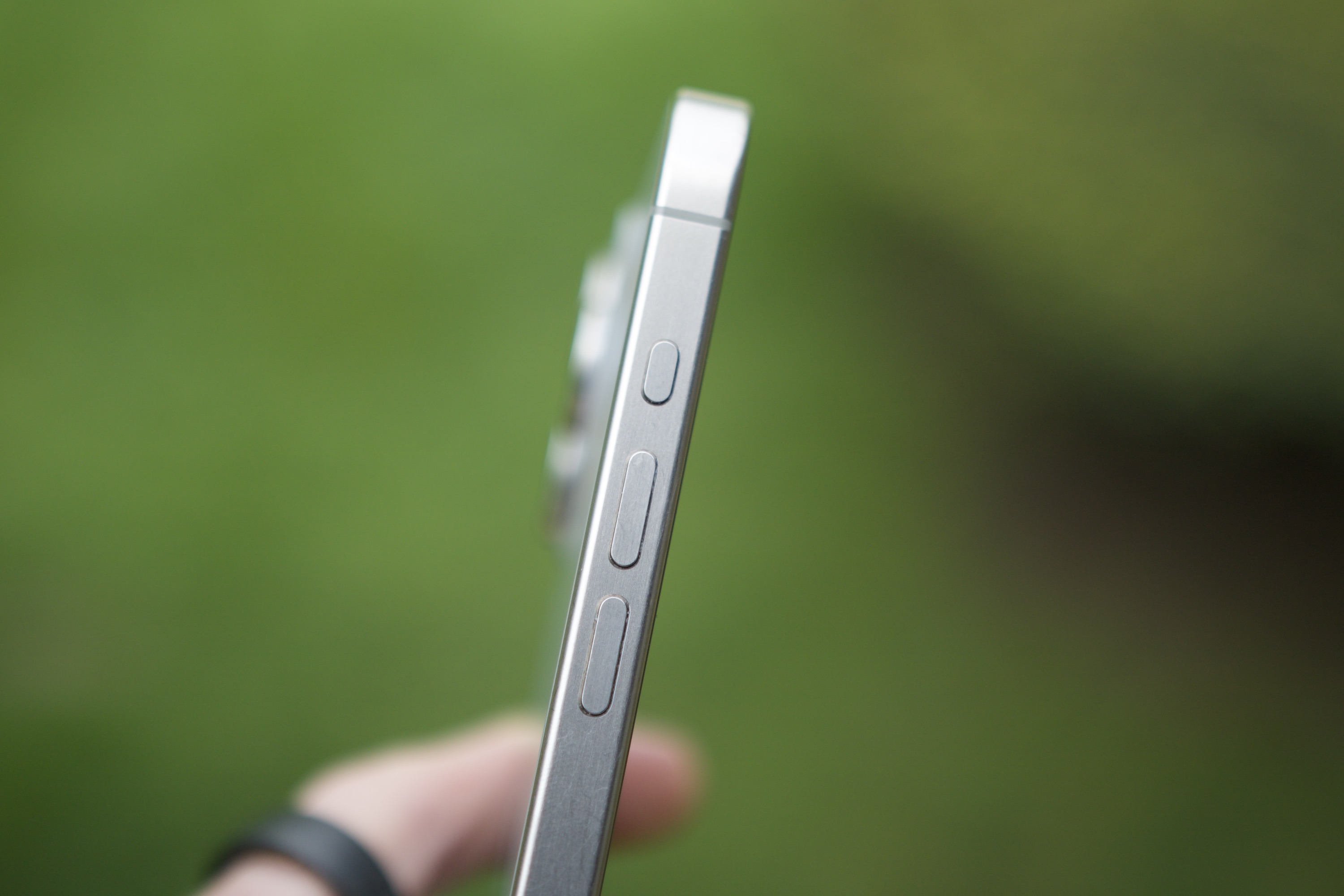 The side of an iPhone 15 Pro Max, showing its Action button.