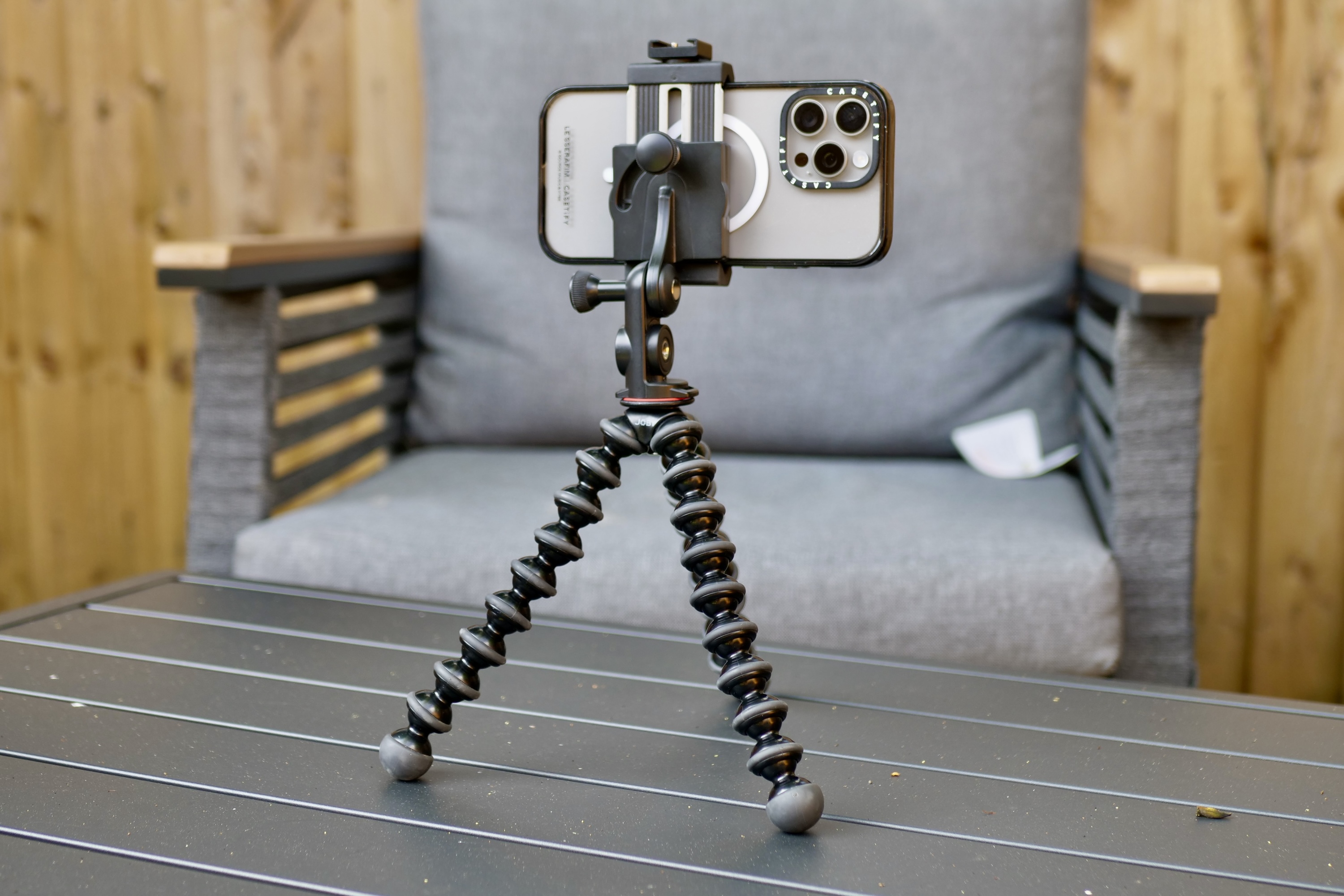 An iPhone 15 Pro Max attached to a Joby GorillaPod tripod.