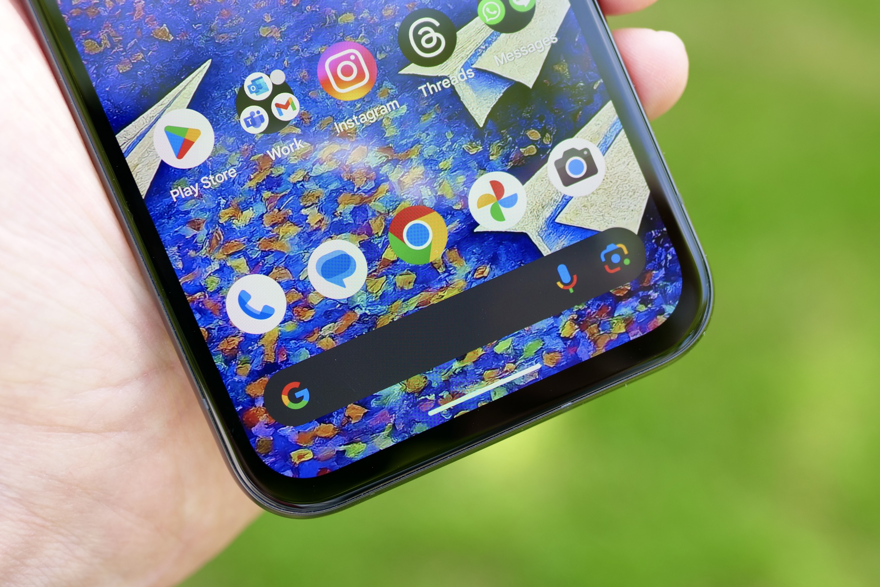 The Google Pixel 8a's bezels at the base of the screen.