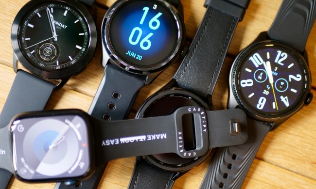 Different smartwatch models with displays illuminated.